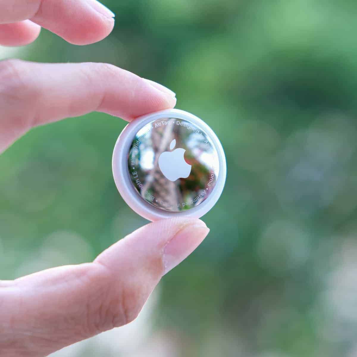 person holding silver round ornament