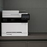 a white and black printer sitting on top of a counter