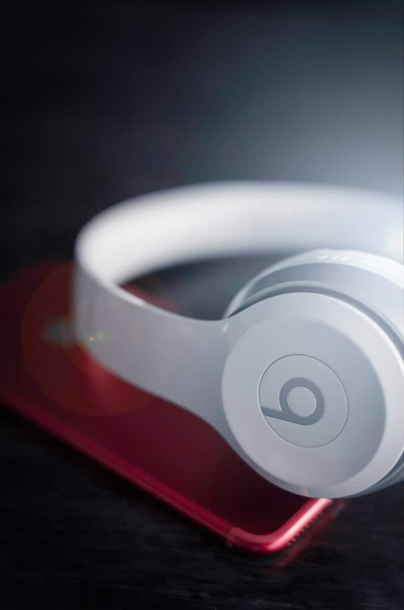 closeup photo of white Beats by Dr. Dre wireless headphones