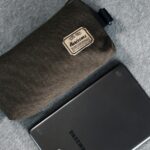 black samsung android smartphone on gray textile