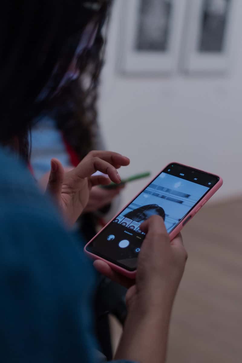 A woman holding a smart phone in her hands