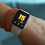 silver aluminum case apple watch with red sport band