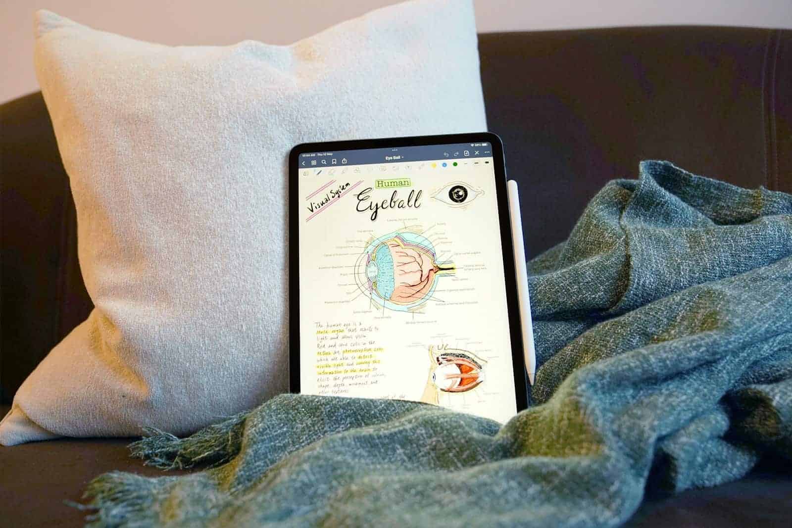 an ipad on a blanket