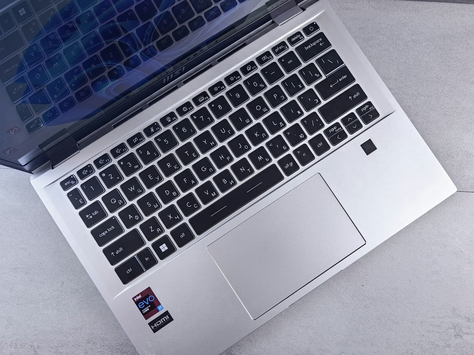 an open laptop computer sitting on top of a table