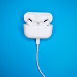 white apple charger on white electric socket