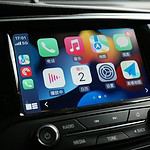 a car dashboard with various app icons on it