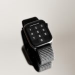 an apple watch with a bunch of metal bands